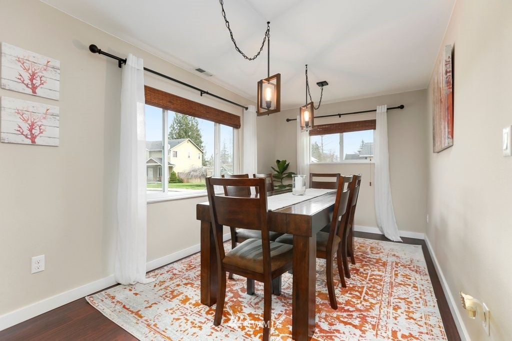2329 Cedar Road Lake Stevens, WA 98258 - Photo 11 of 40 a view of a dining room with furniture window and wooden floor