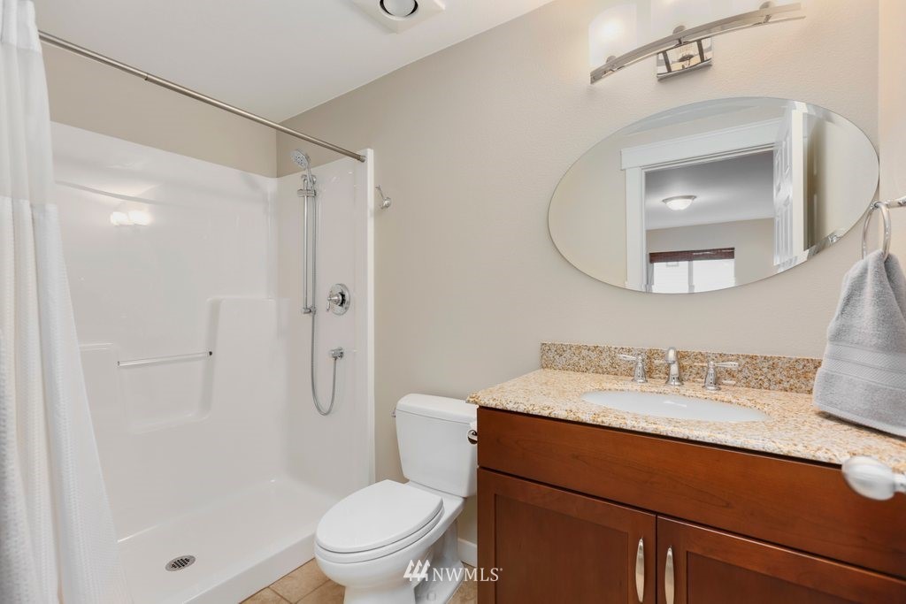 2329 Cedar Road Lake Stevens, WA 98258 - Photo 20 of 40 a bathroom with a sink toilet vanity and shower