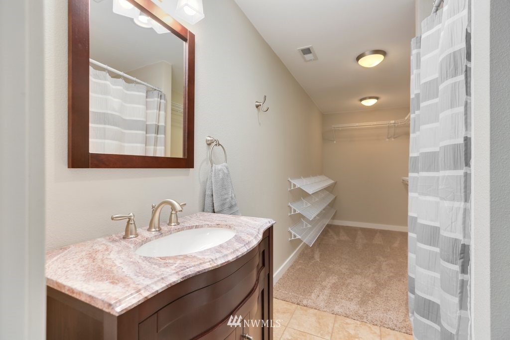 2329 Cedar Road Lake Stevens, WA 98258 - Photo 24 of 40 a bathroom with a granite countertop sink and a mirror