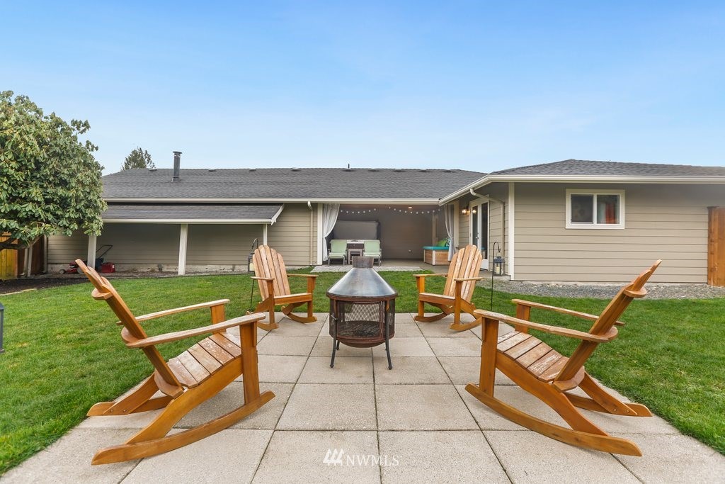 2329 Cedar Road Lake Stevens, WA 98258 - Photo 30 of 40 a view of a patio with table and chairs and a yard