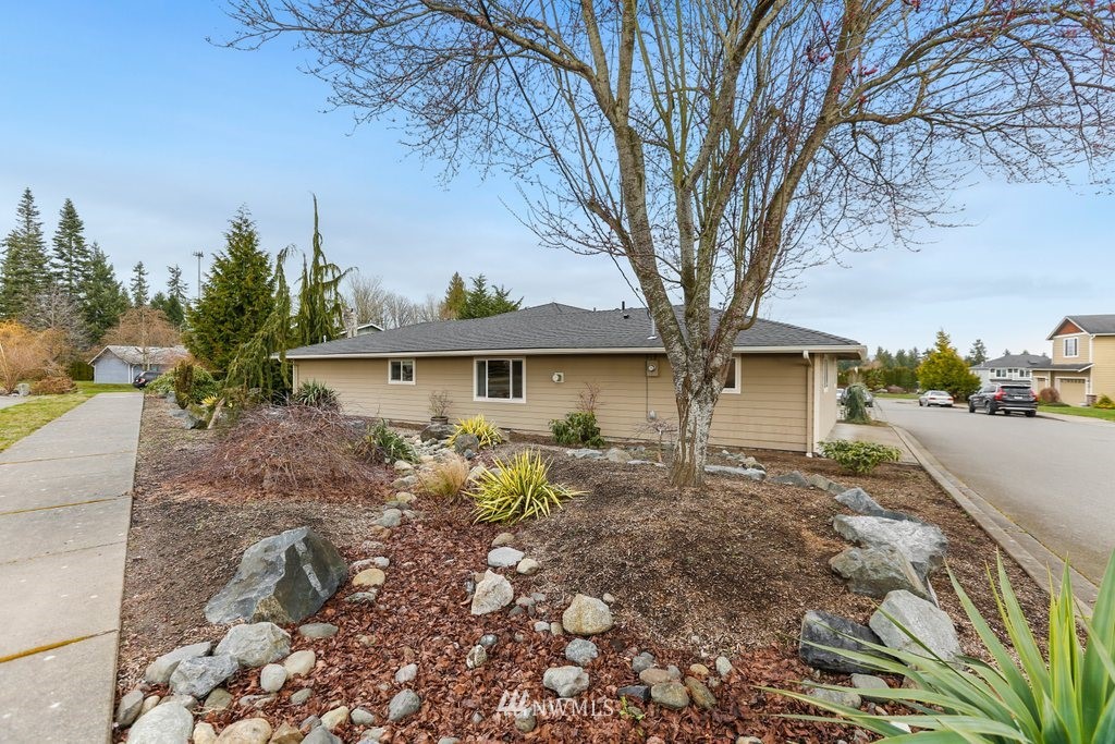 2329 Cedar Road Lake Stevens, WA 98258 - Photo 37 of 40 a view of a house with a tree in the background