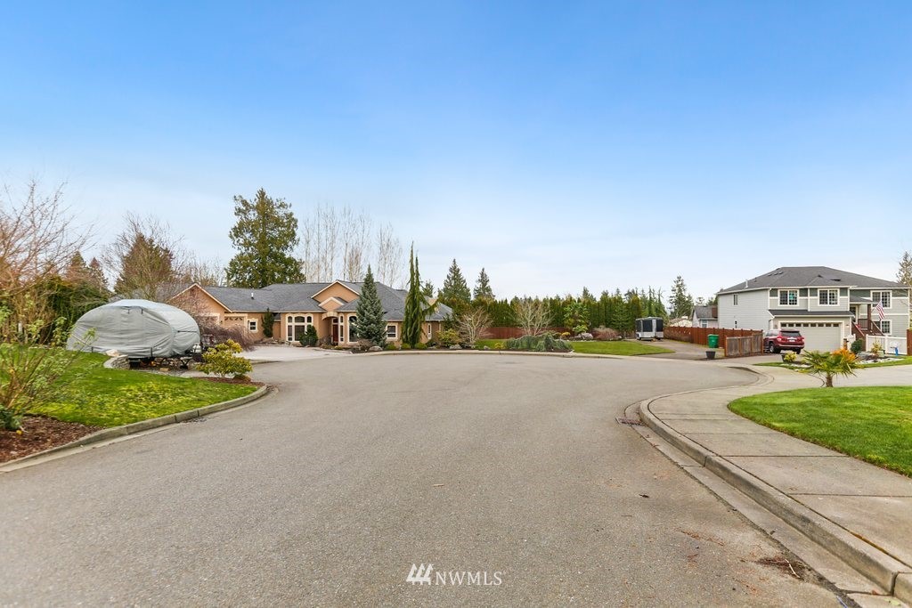 2329 Cedar Road Lake Stevens, WA 98258 - Photo 38 of 40 a view of a street with a cars parked and a houses