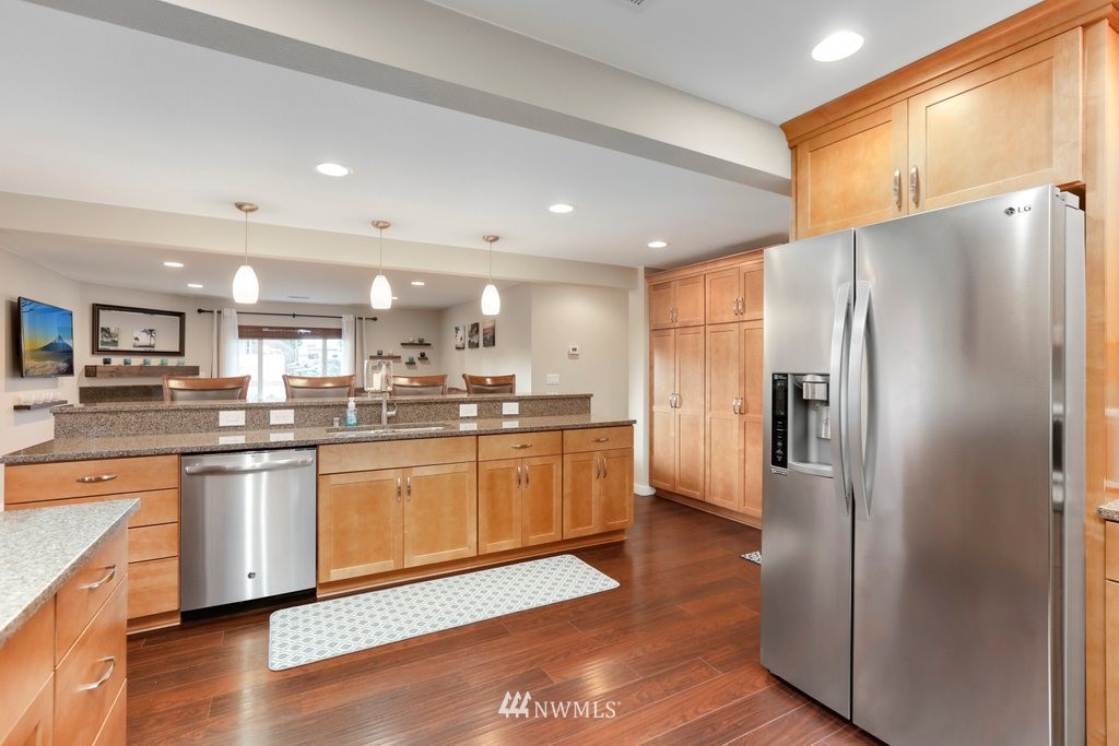 2329 Cedar Road Lake Stevens, WA 98258 - Photo 9 of 40 a kitchen with stainless steel appliances granite countertop a refrigerator and a stove top oven