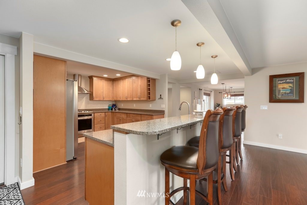 2329 Cedar Road Lake Stevens, WA 98258 - Photo 10 of 40 a kitchen with cabinets and chairs