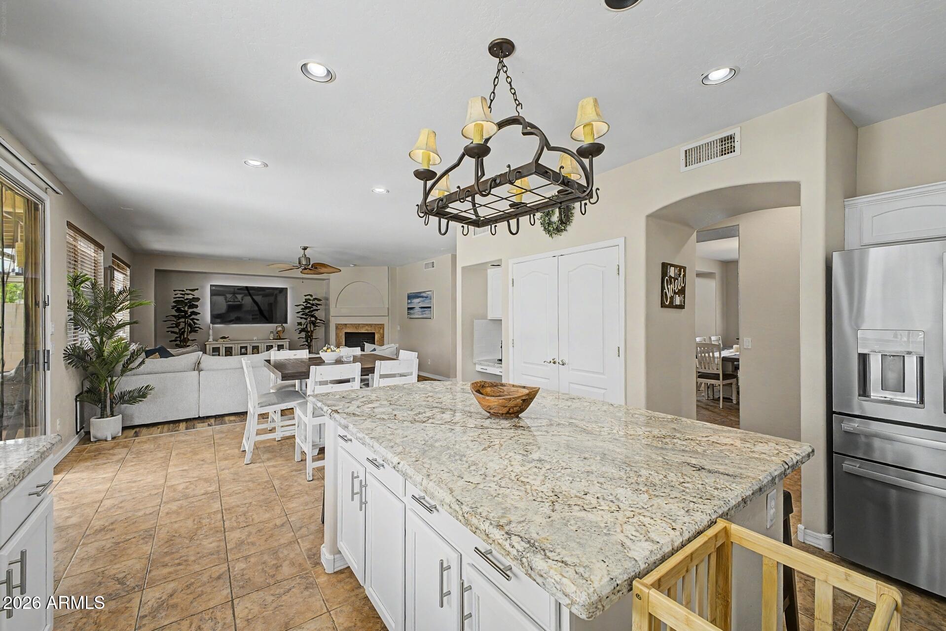 3595 East Latham Way Gilbert, AZ 85297 - Photo 13 of 35 a kitchen with a counter space cabinets and appliances