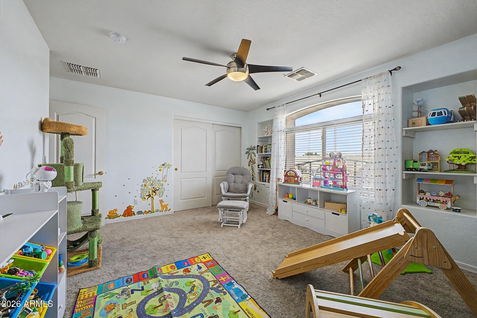 3595 East Latham Way Gilbert, AZ 85297 - Photo 25 of 35 a room with furniture and a wooden floor