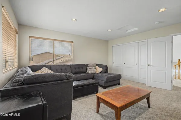 a living room with furniture and a window
