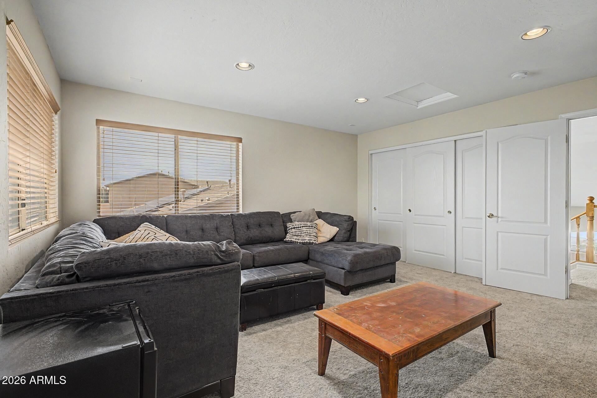 3595 East Latham Way Gilbert, AZ 85297 - Photo 28 of 35 a living room with furniture and a window