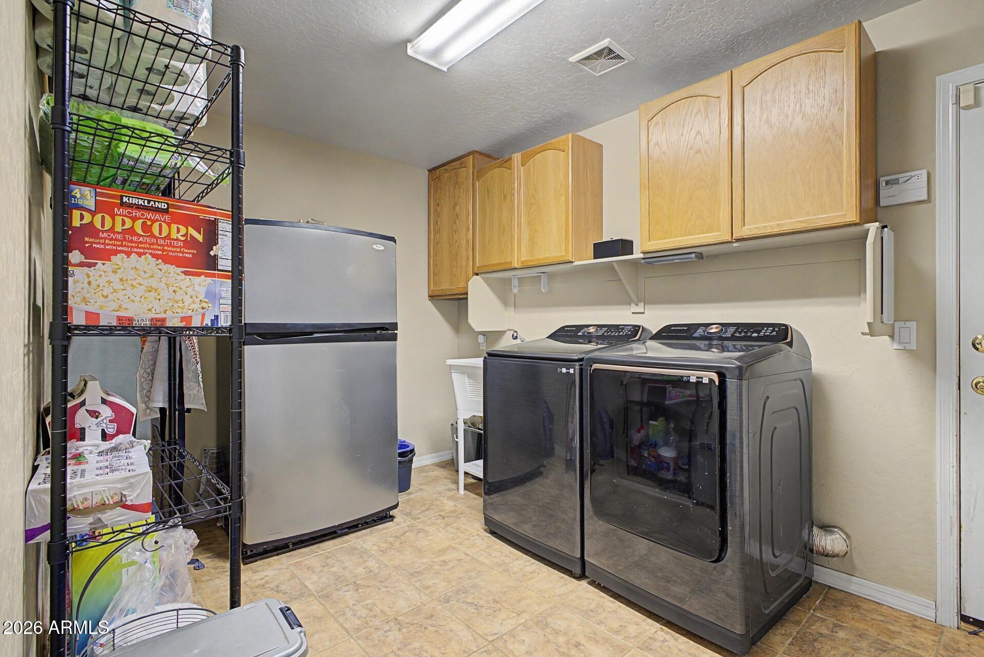 3595 East Latham Way Gilbert, AZ 85297 - Photo 29 of 35 a utility room with dryer and washer