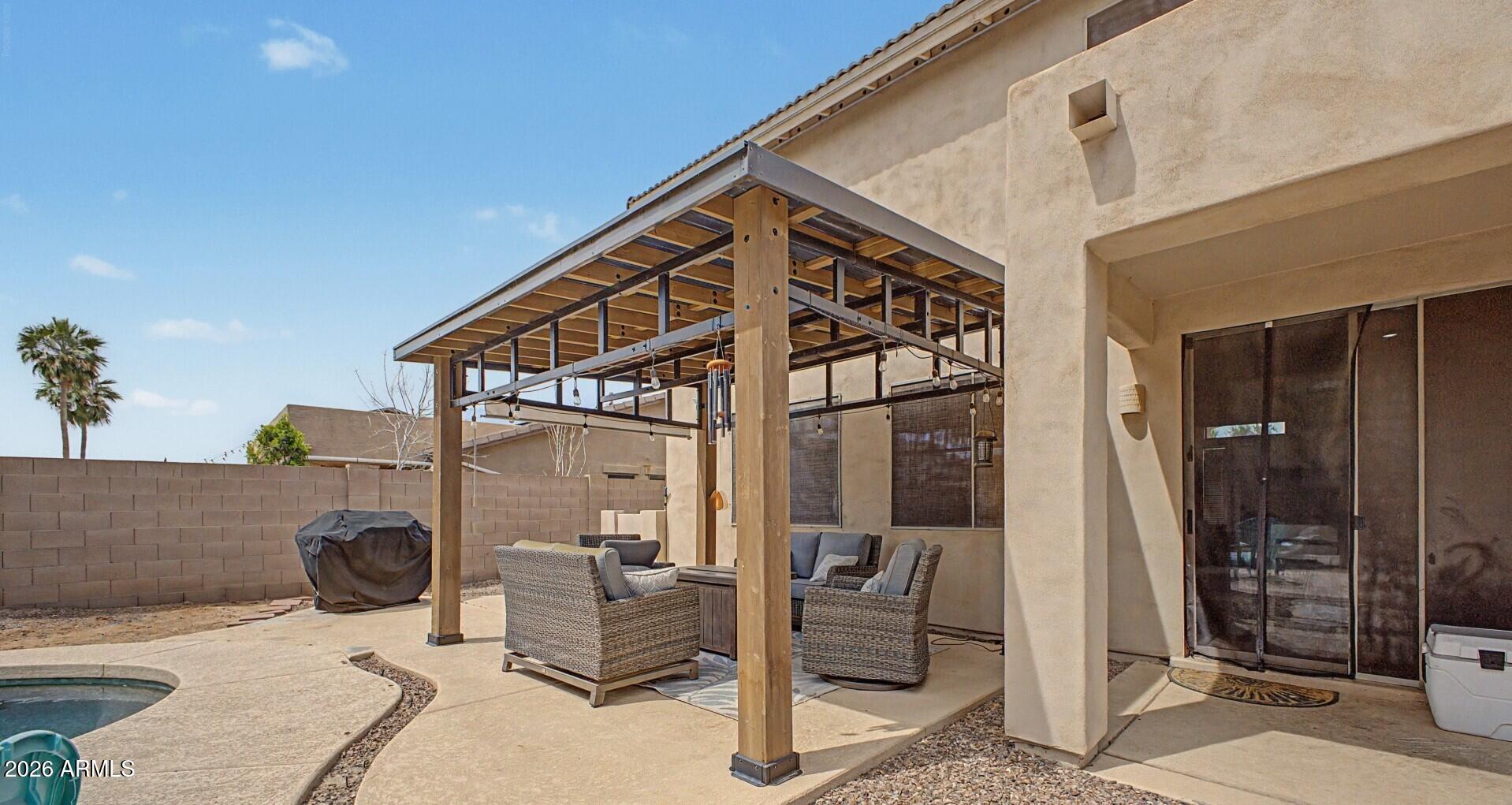 3595 East Latham Way Gilbert, AZ 85297 - Photo 30 of 35 a view of living room kitchen and patio