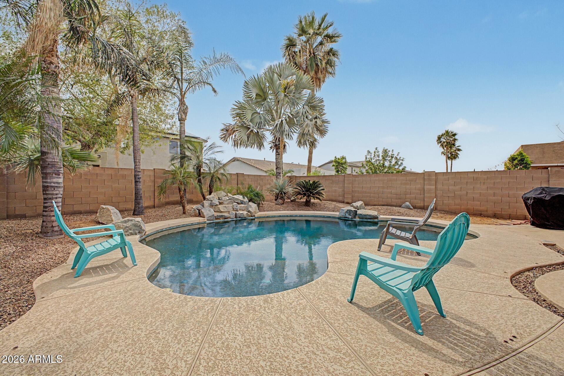 3595 East Latham Way Gilbert, AZ 85297 - Photo 33 of 35 swimming pool with outdoor seating and outdoor space