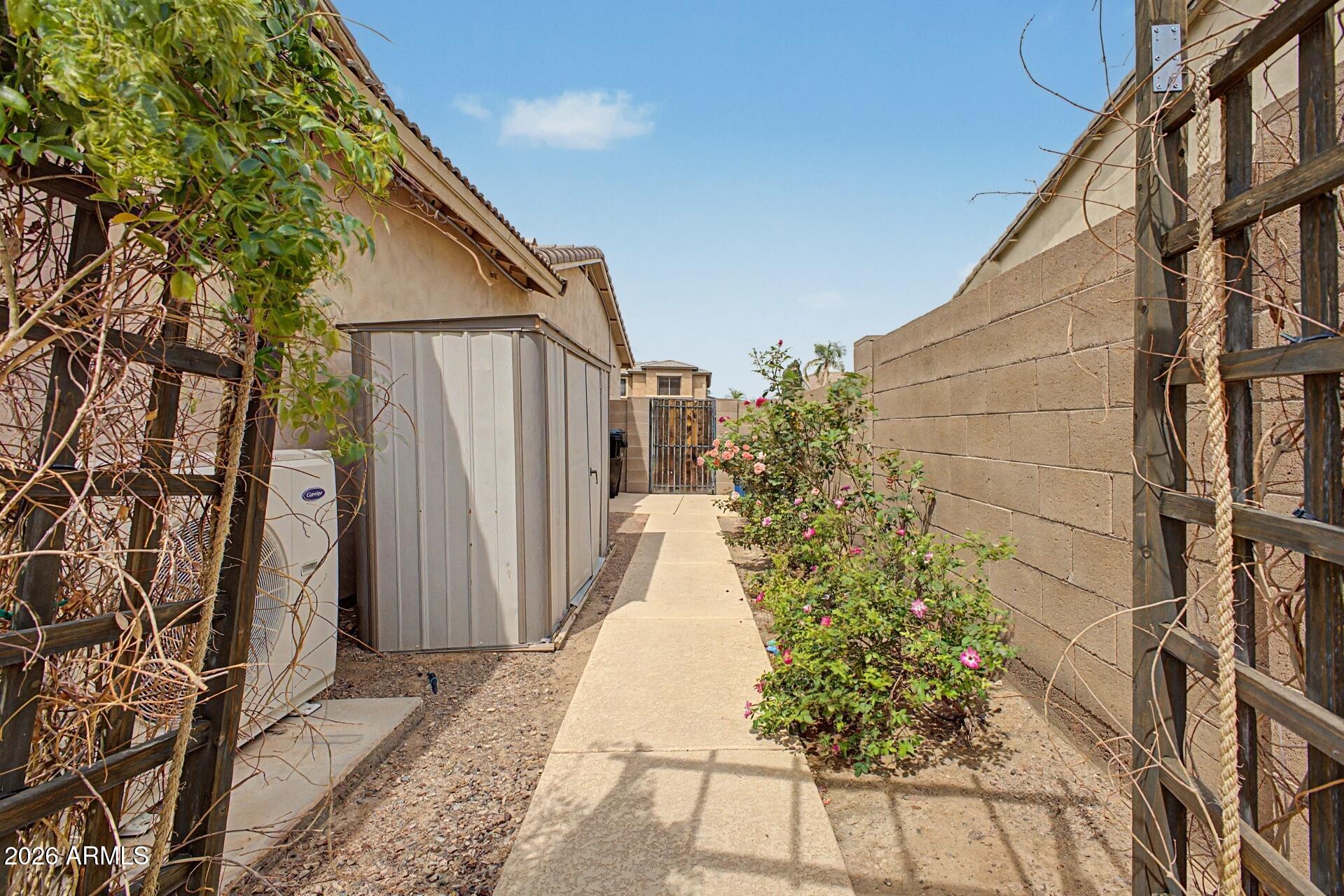 3595 East Latham Way Gilbert, AZ 85297 - Photo 35 of 35 a view of a house with a small yard