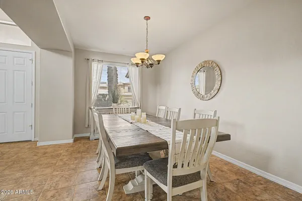 a view of a dining room with furniture window and chandelier