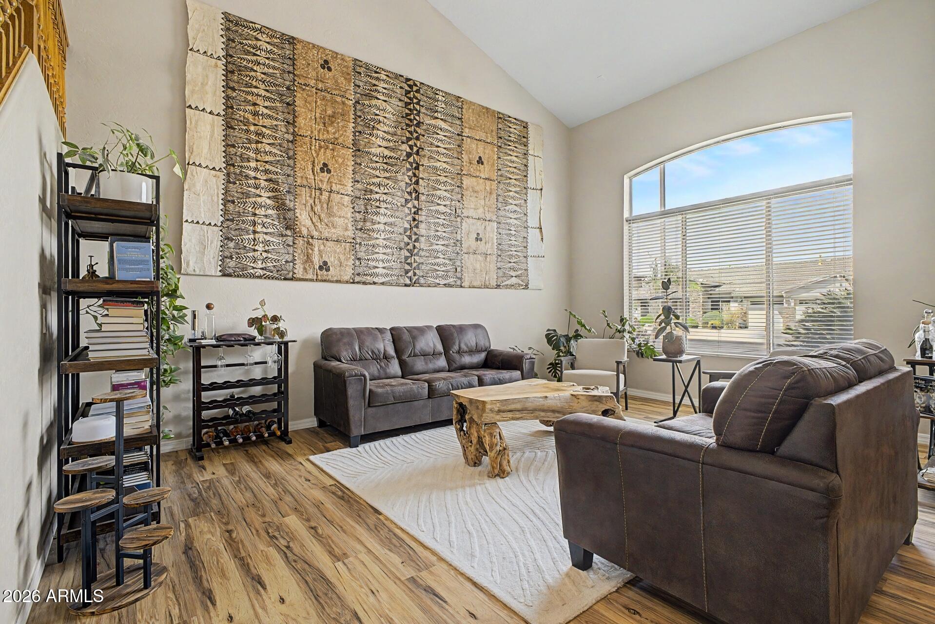3595 East Latham Way Gilbert, AZ 85297 - Photo 5 of 35 a living room with furniture and a flat screen tv