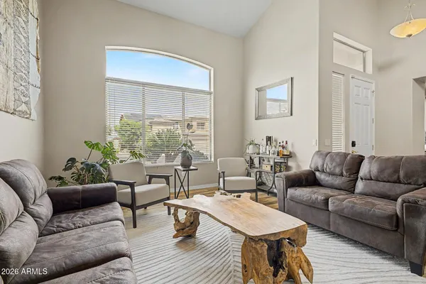 a living room with furniture and a large window