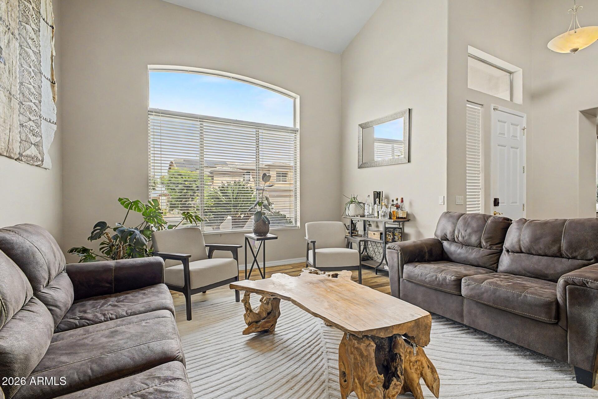 3595 East Latham Way Gilbert, AZ 85297 - Photo 6 of 35 a living room with furniture and a large window