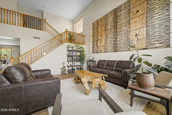 a living room with furniture and a large window
