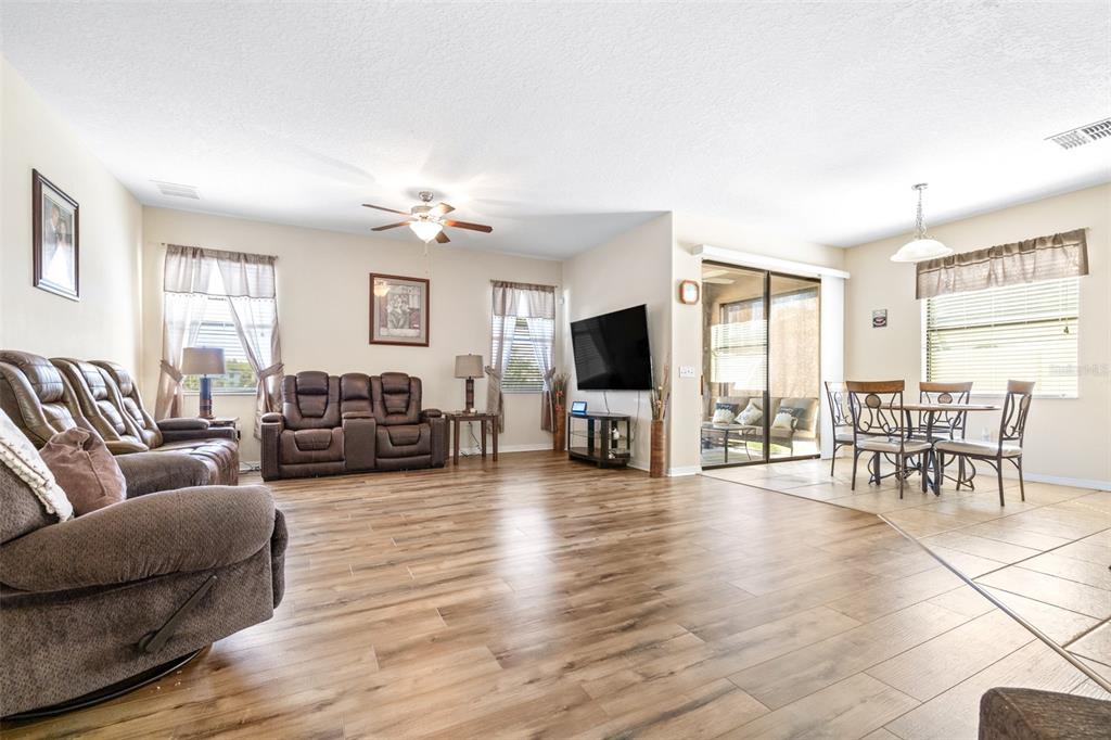 1564 Imperial Key Drive Trinity, FL 34655 - Photo 12 of 40 a living room with furniture flat screen tv and wooden floor