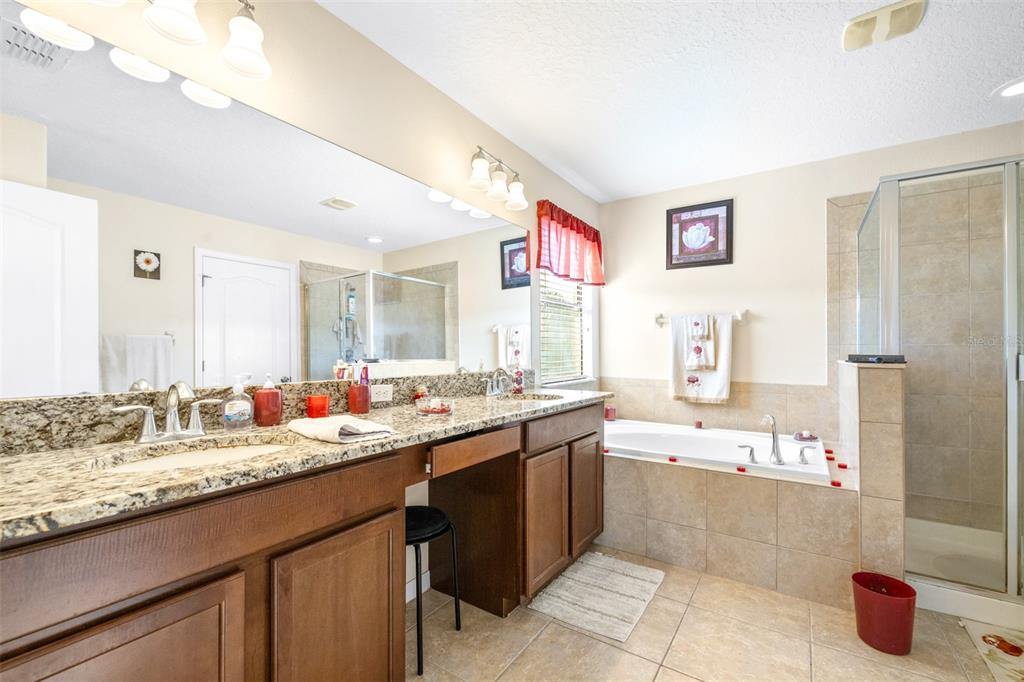 1564 Imperial Key Drive Trinity, FL 34655 - Photo 21 of 40 a bathroom with a sink double vanity and a