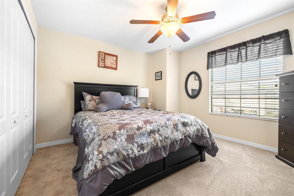 1564 Imperial Key Drive Trinity, FL 34655 - Photo 25 of 40 a bedroom with a bed and a window