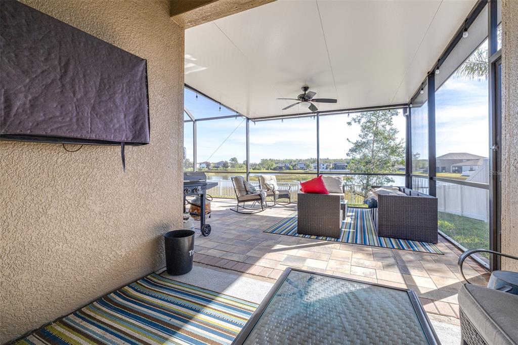 1564 Imperial Key Drive Trinity, FL 34655 - Photo 30 of 40 a living room with furniture and a floor to ceiling window
