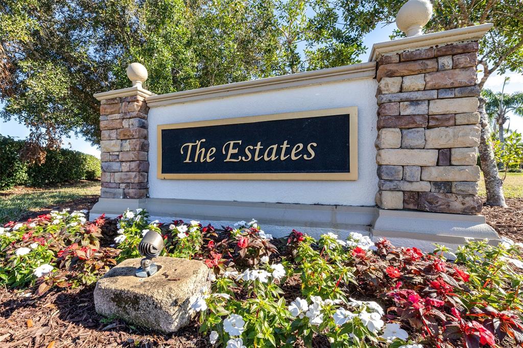 1564 Imperial Key Drive Trinity, FL 34655 - Photo 40 of 40 a sign that is sitting in front of flowers