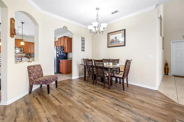 a view of a dining area with furniture and wooden floor