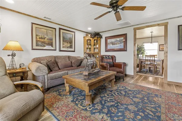 a kitchen with stainless steel appliances granite countertop a refrigerator a stove a sink and a microwave