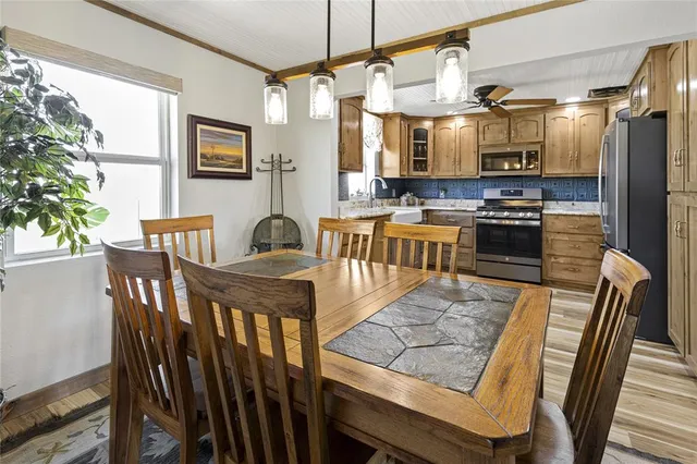 a view of a dining room with furniture window and wooden floor