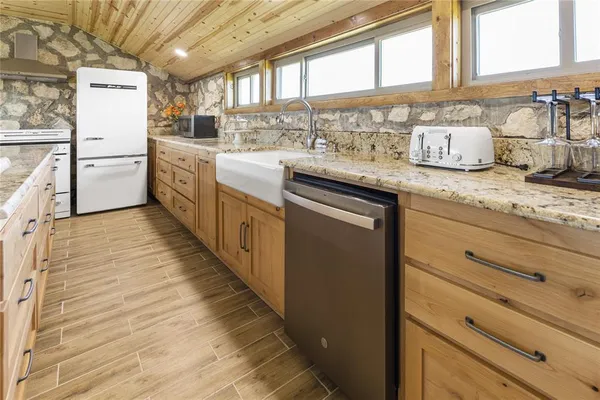 a view of a backyard with a wooden fence