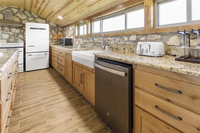 a view of a backyard with a wooden fence