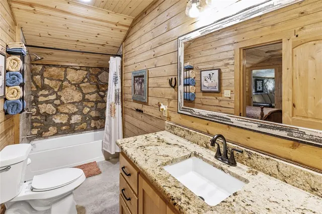 a view of a kitchen with a sink and cabinets
