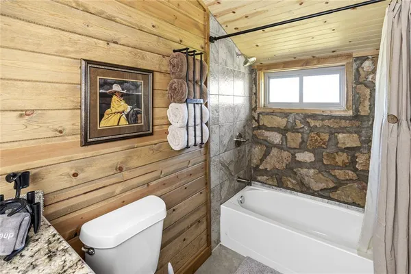 a view of granite countertop kitchen sink and stove