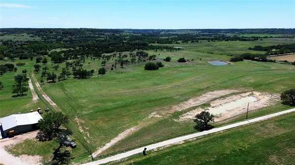 a view of a green field with clear sky