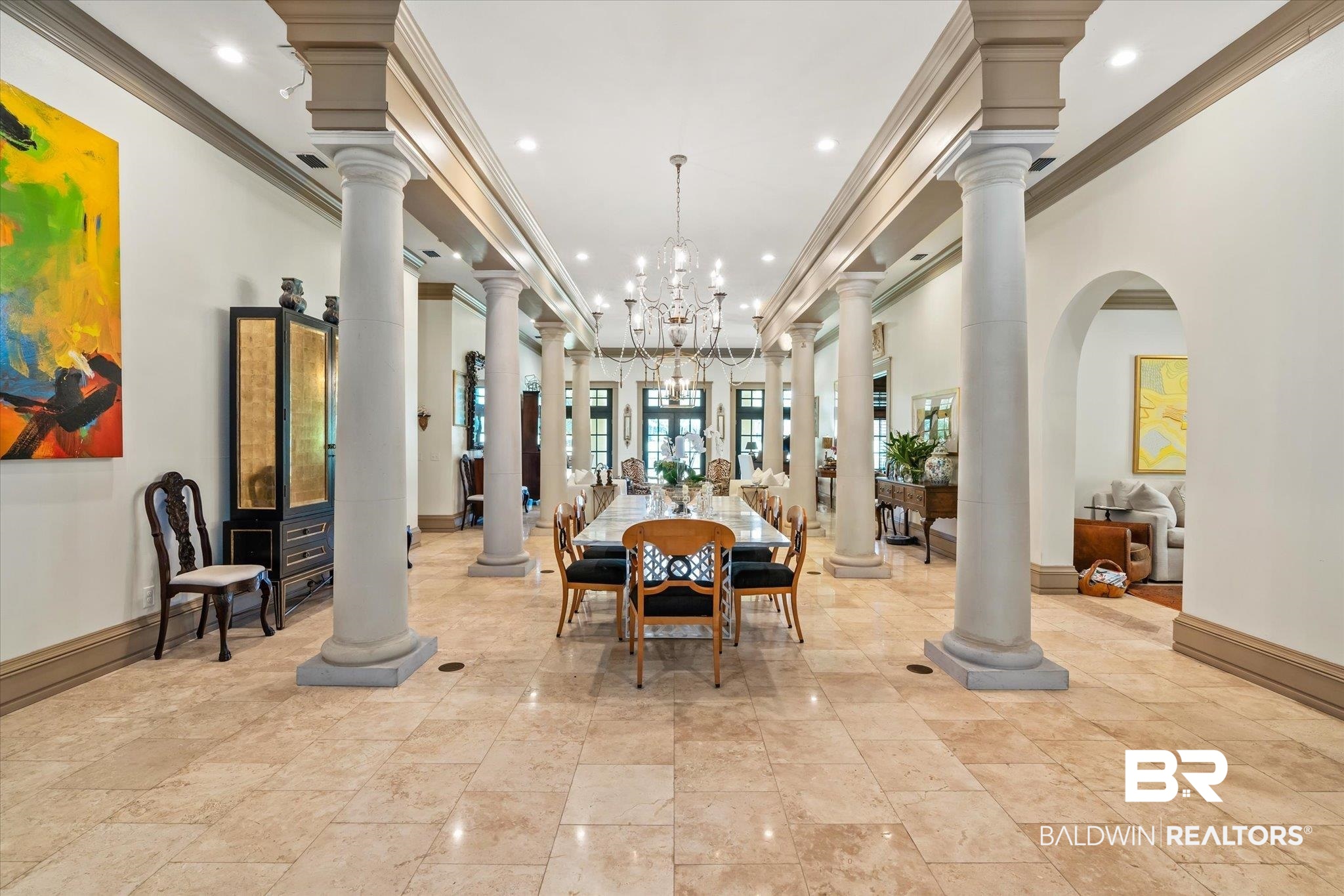 6341 Raintree Road Fairhope, AL 36532 - Photo 5 of 40 Interior space with a towering ceiling, decorative columns, an inviting chandelier, and ornamental molding
