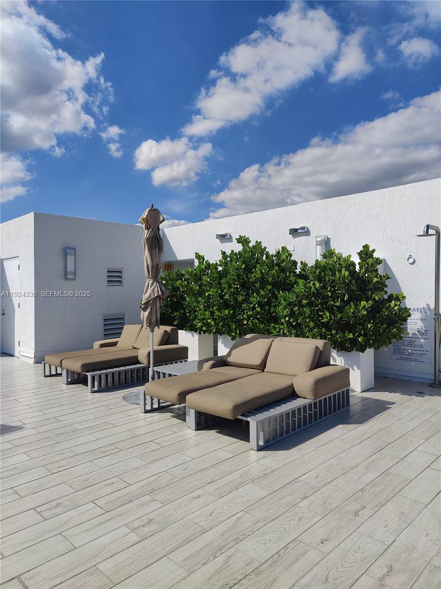 4250 Biscayne Boulevard, Unit 514 Miami, FL 33137 - Photo 5 of 16 a view of a terrace with seating space