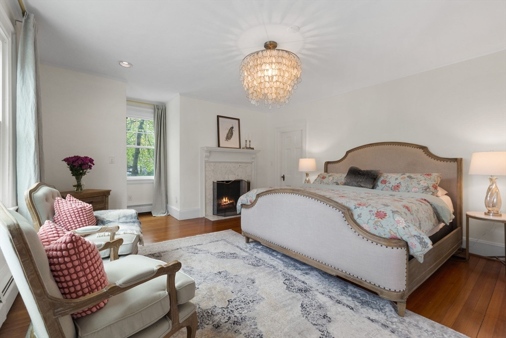 20 Eulow Street Swampscott, MA 01907 - Photo 13 of 42 a bedroom with bed and a fireplace