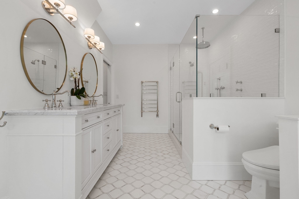 20 Eulow Street Swampscott, MA 01907 - Photo 19 of 42 a bathroom with a double vanity sink mirror and toilet