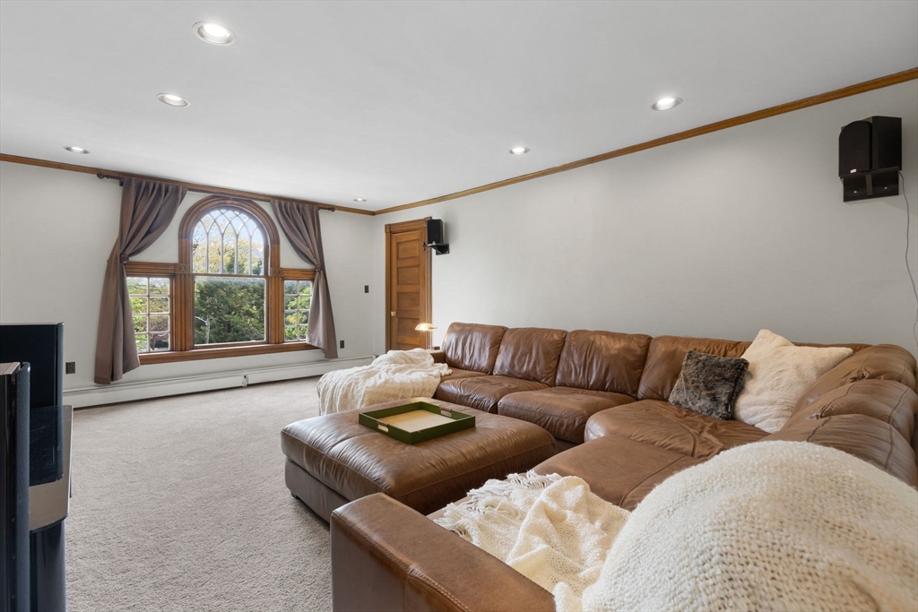 20 Eulow Street Swampscott, MA 01907 - Photo 27 of 42 a living room with furniture and a flat screen tv
