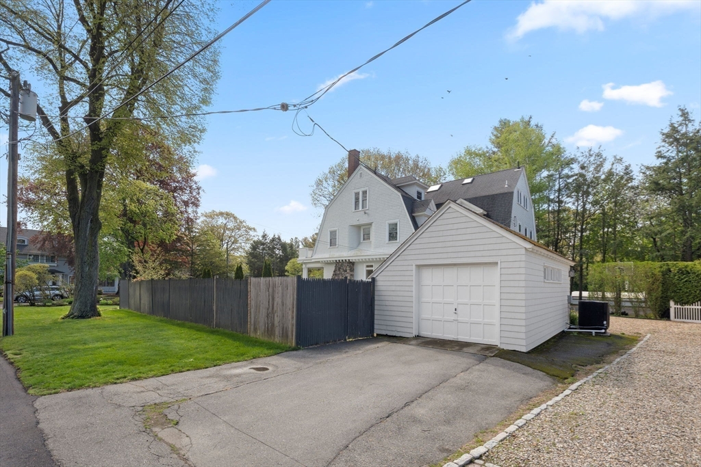 20 Eulow Street Swampscott, MA 01907 - Photo 41 of 42 a view of a house with a yard plants and large tree
