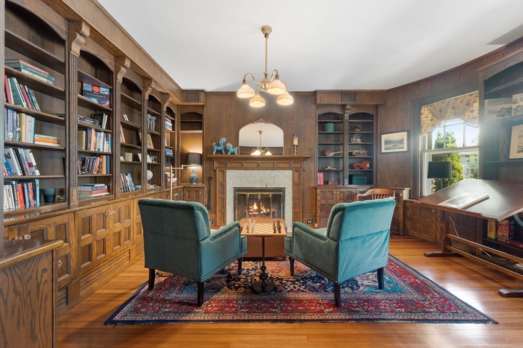 20 Eulow Street Swampscott, MA 01907 - Photo 10 of 42 a living room with furniture a bookshelf and a fireplace