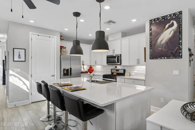 a front view of a house with garden and porch