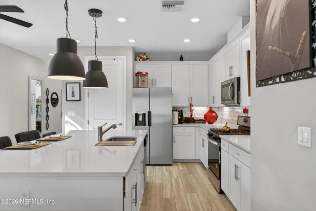 an aerial view of a house with a swimming pool