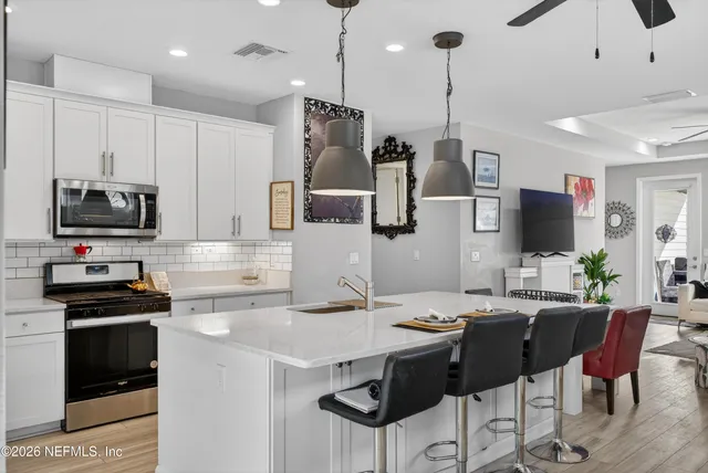 a view of a dining room with furniture window and outside view