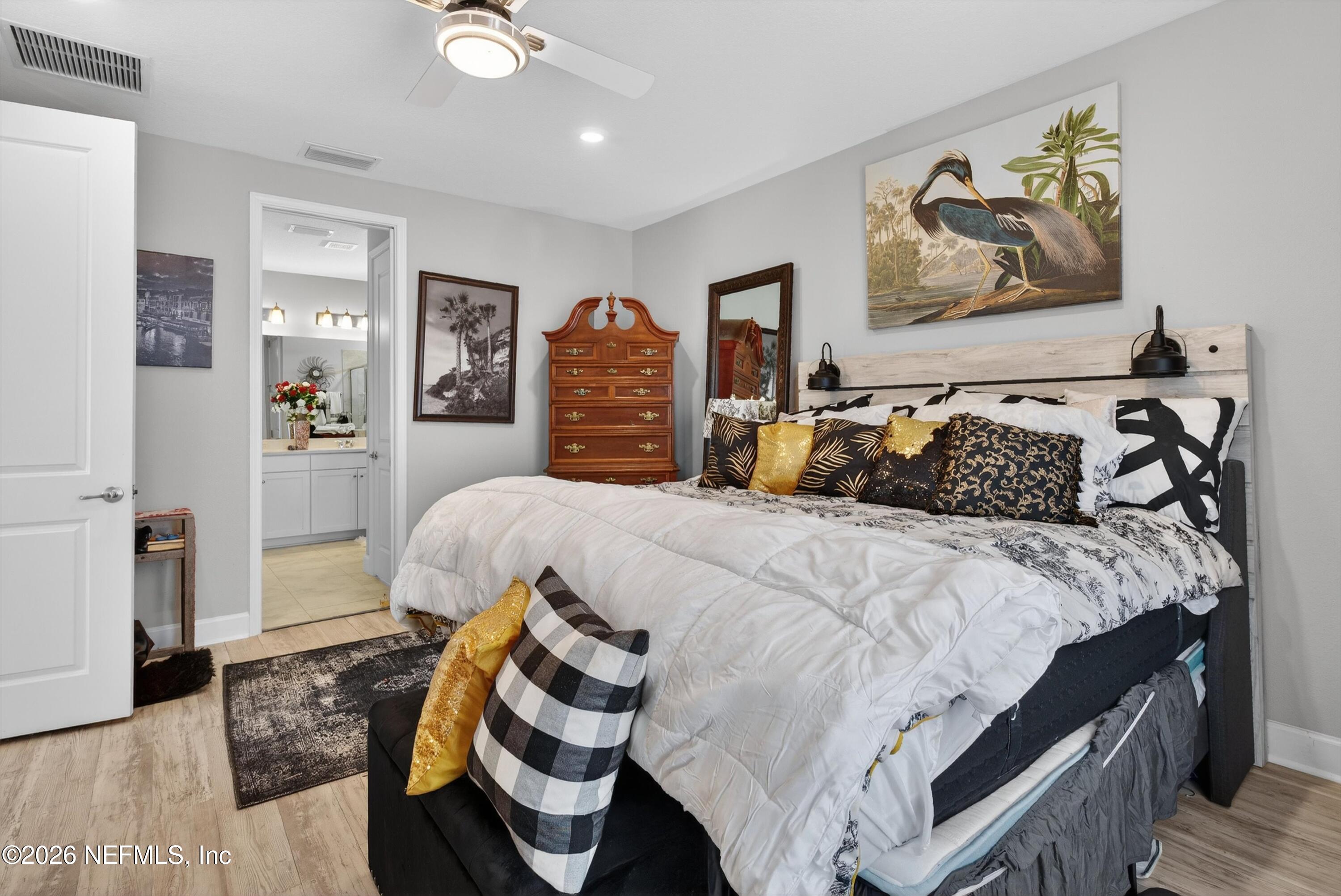 1055 Rustic Mill Dr Street St. Augustine, FL 32092 - Photo 19 of 87 a bedroom with a bed and wooden floor