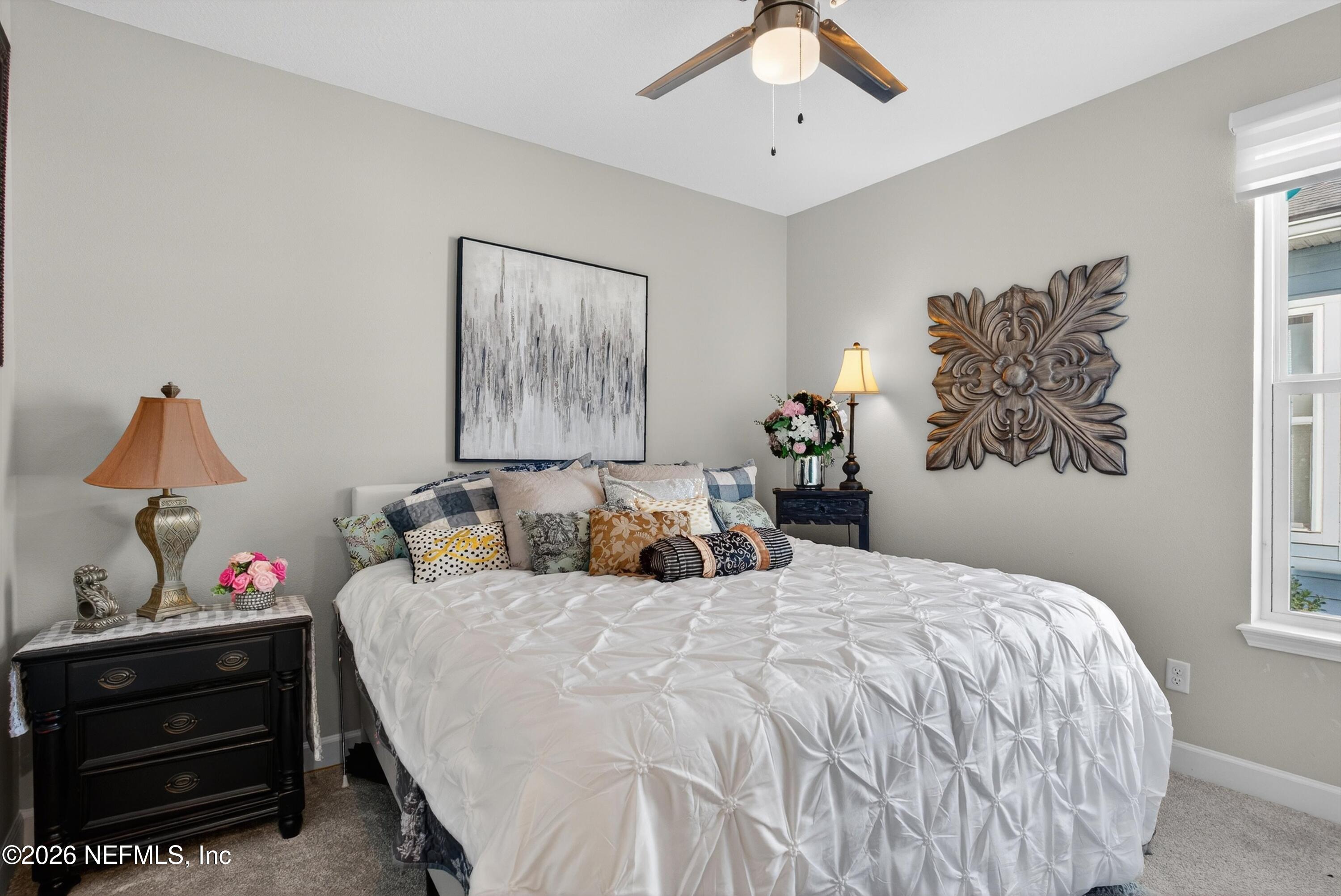 1055 Rustic Mill Dr Street St. Augustine, FL 32092 - Photo 22 of 87 a bedroom with a bed and a window