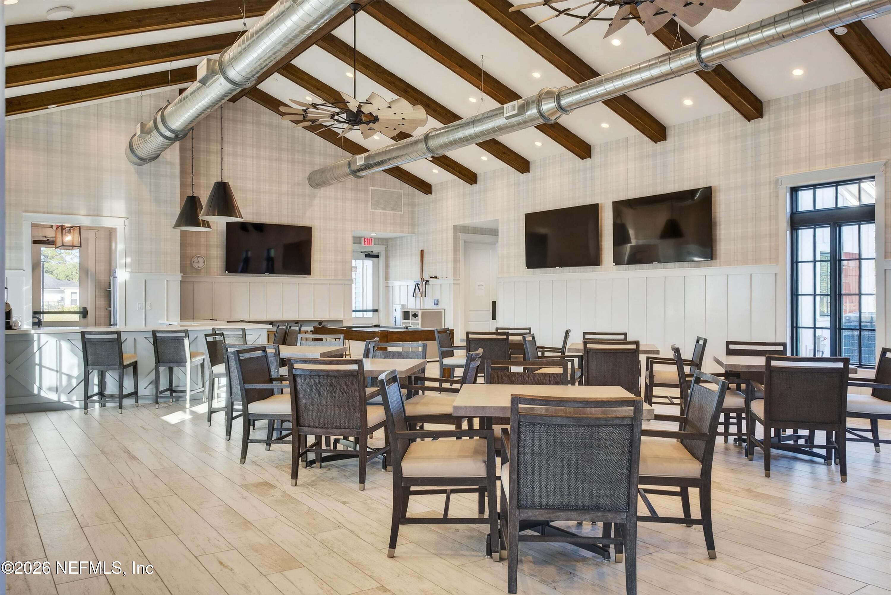 1055 Rustic Mill Dr Street St. Augustine, FL 32092 - Photo 50 of 87 a view of a dining room with furniture window and wooden floor