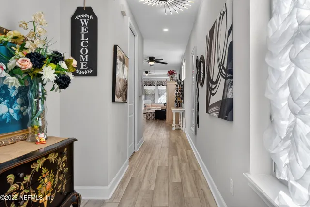 a kitchen with stainless steel appliances kitchen island granite countertop a sink and a refrigerator