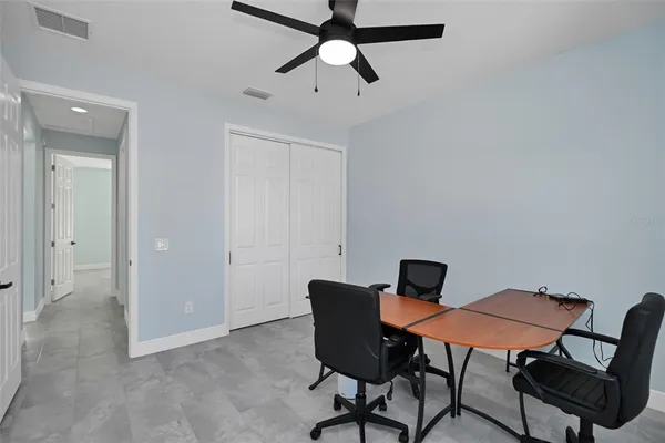 a view of a workspace with furniture