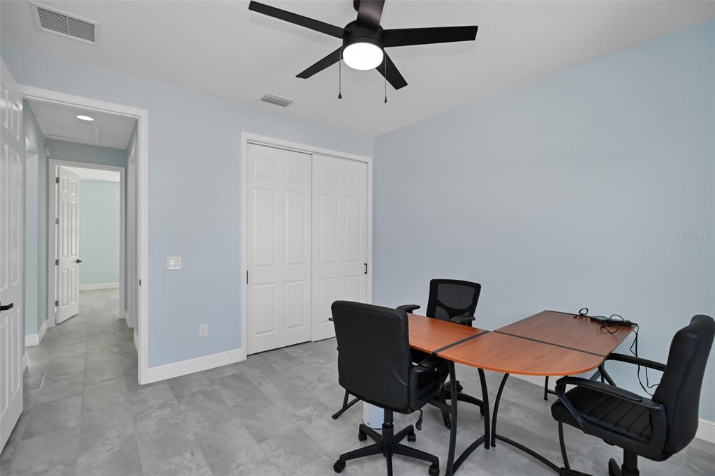 7604 Southwest 103rd Loop Ocala, FL 34476 - Photo 13 of 20 a view of a workspace with furniture